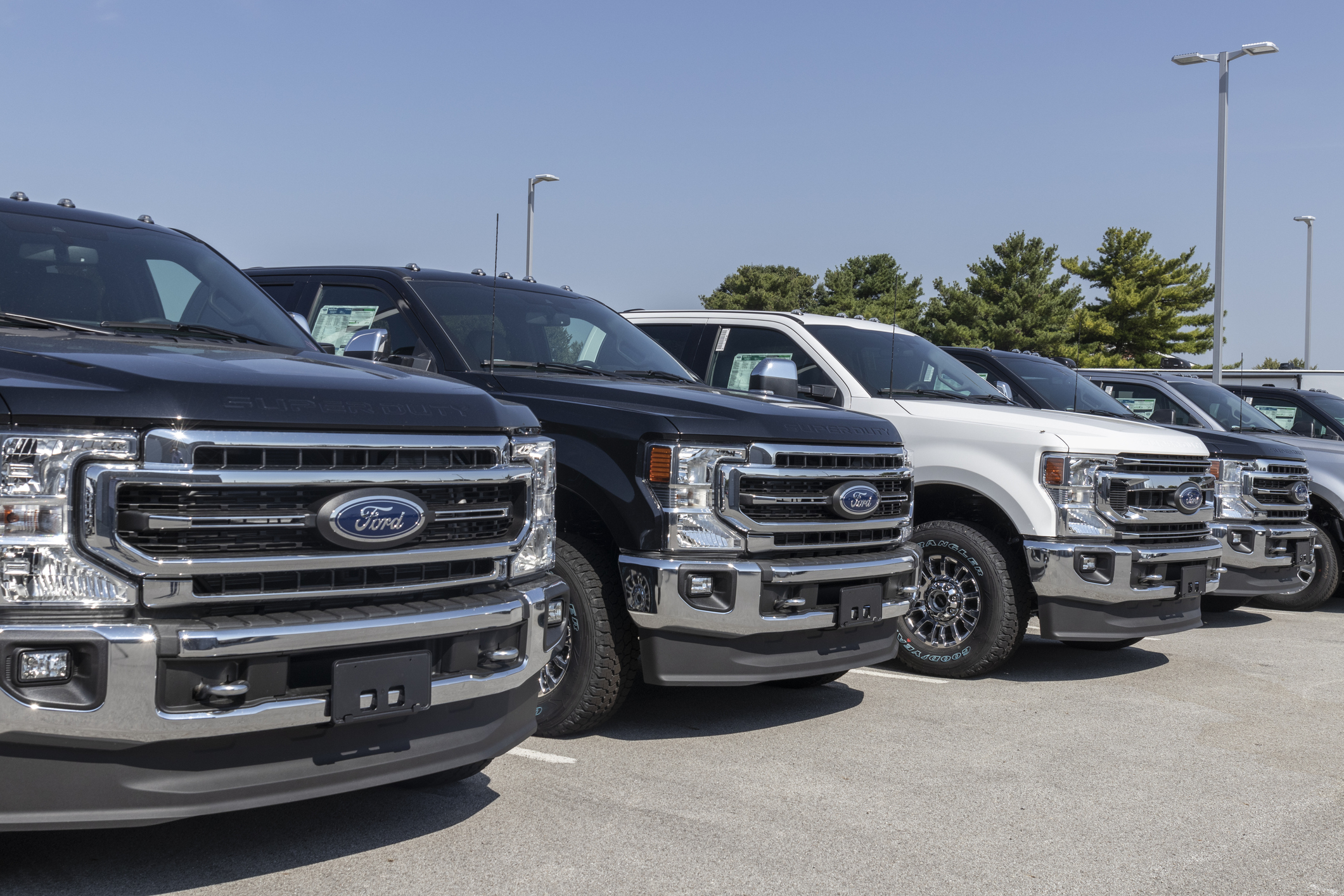 Ford F-Series Trucks Display. The Ford F-150, Super Duty F-250, F-350 and F-450 are the best selling trucks in the US.
